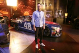 Jimmie Johnson poses in front of "Batman v Superman: Dawn of Justice" film-inspired No. 48 Superman Chevrolet at Warner Bros. Studios on Thursday, March 17, 2016, in Burbank, CA. (Photo by Eric Charbonneau/Invision for Warner Bros./AP Images)