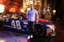 Jimmie Johnson poses in front of "Batman v Superman: Dawn of Justice" film-inspired No. 48 Superman Chevrolet at Warner Bros. Studios on Thursday, March 17, 2016, in Burbank, CA. (Photo by Eric Charbonneau/Invision for Warner Bros./AP Images)
